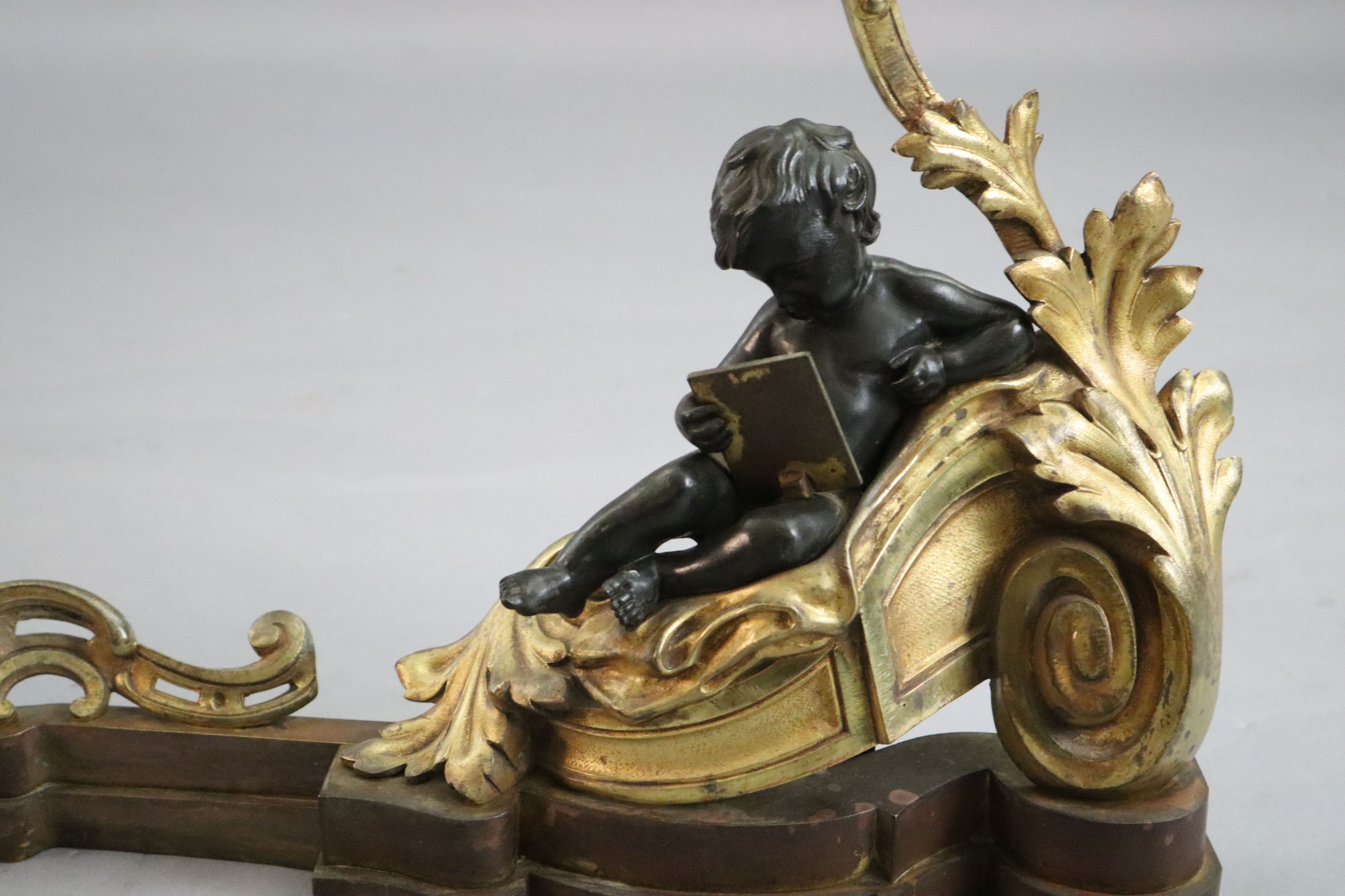 A Louis XVI style bronze and ormolu fender, length 48in. height 24in.